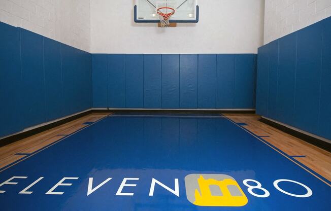 Indoor basketball court with property logo on floor