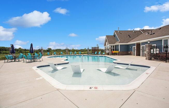 our apartments showcase an outdoor pool at Meadowbrooke Apartment Homes, Michigan