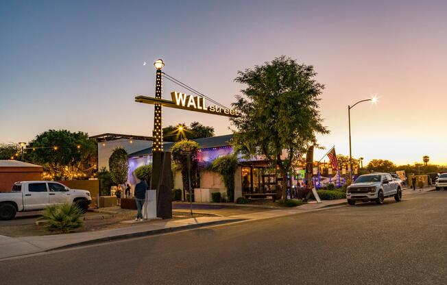 Visit nearby Wall Street with local restaurants, evening lights, and a walkable atmosphere that comes alive after sunset.