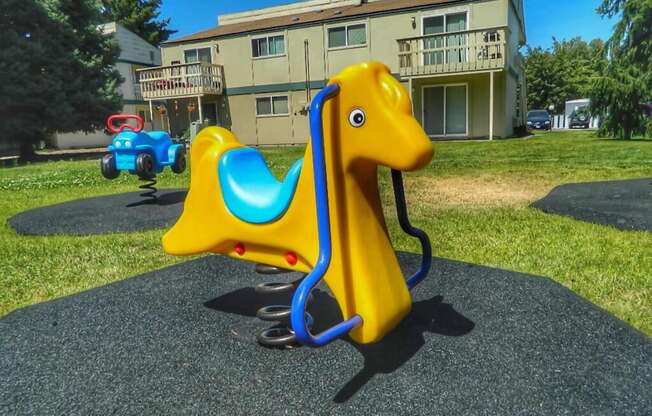 La Verde Apartments Outdoor Playground with Spring Riders