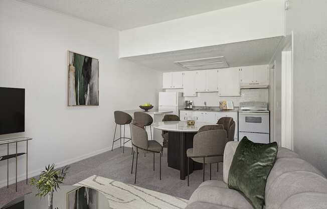 Apartment living room with kitchen in the back at Tanglewood Apartments