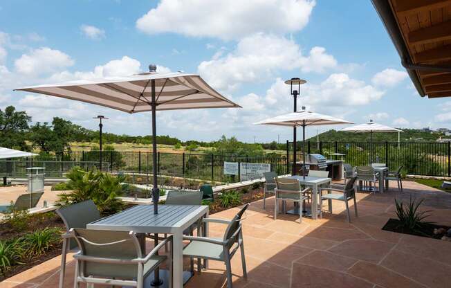 Outdoor Grilling Area and Tables at The Artesian at Bee Cave