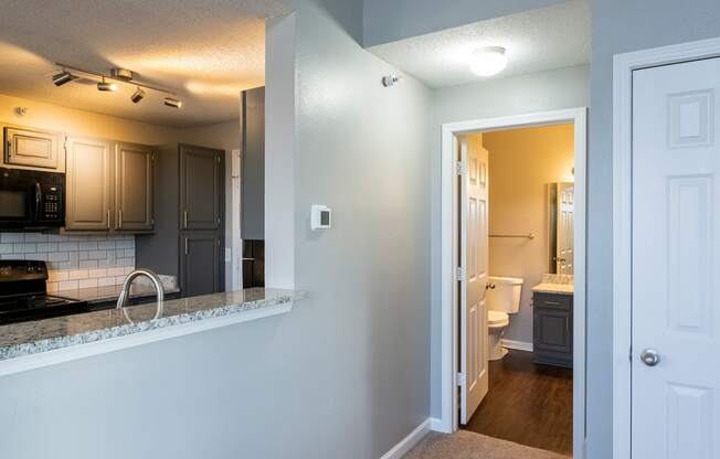 Open wall space with counter top from kitchen