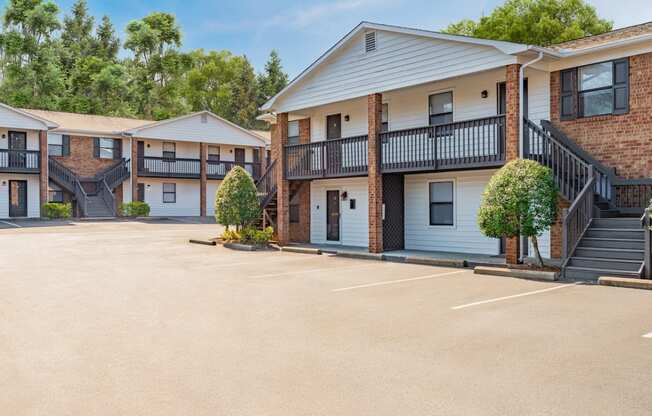 a parking lot at the whispering winds apartments in pearland, tx