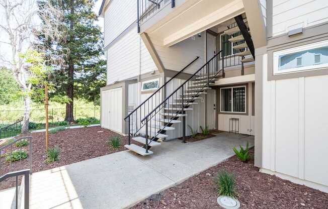 A modern house with a staircase leading to the second floor.