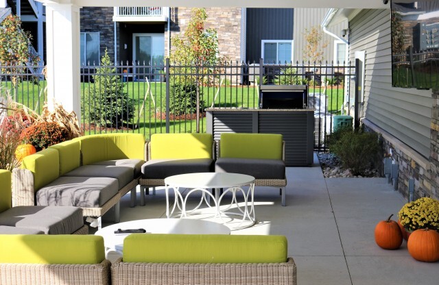 Outdoor lounge furniture with large outdoor tv and gas grill