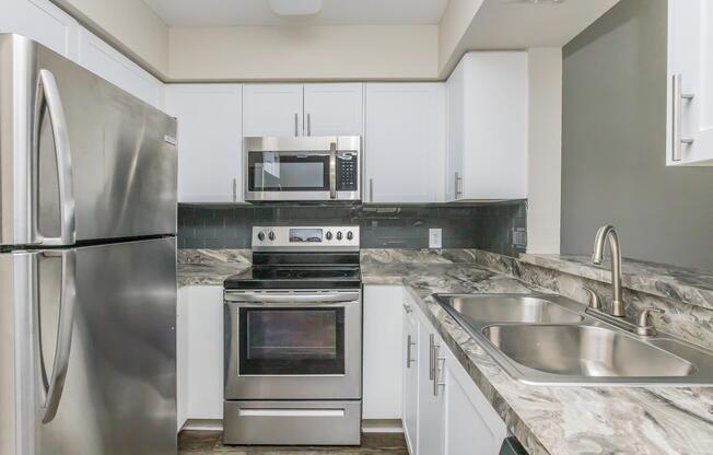 a kitchen with stainless steel appliances