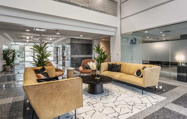 A modern living room with a yellow sofa and a coffee table.