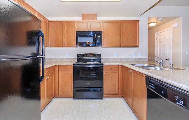 Enjoy the sleek black appliances in the kitchens at Boulder Creek