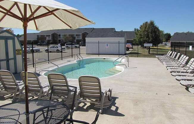 Poolside Sundeck With Relaxing Chairs at Bradford Place Apartments, Lafayette, IN