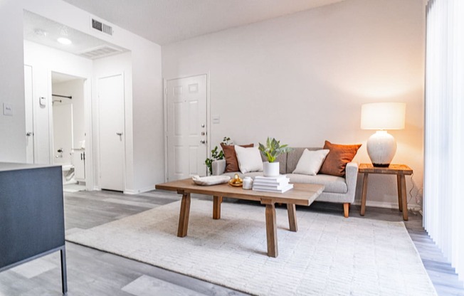 a living room with a couch and a table