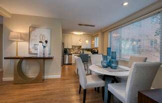 a dining room with a table and chairs