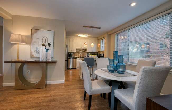 a dining room with a table and chairs