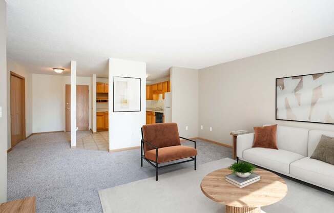 A living room with a brown chair and a white couch.