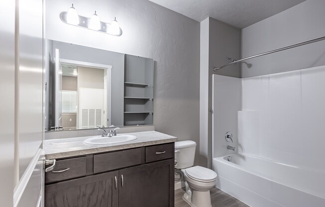 a bathroom with a toilet sink and bathtub