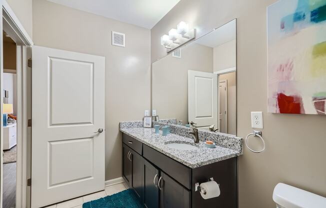 a bathroom with black and white triangles on the wall