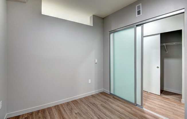 Apartments in Bothell WA-98th Avenue Bedroom with Sliding Glass Doors and Large Walk-In Closet