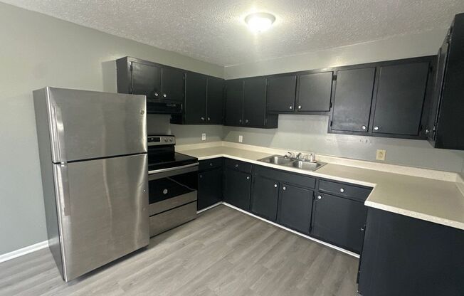 FIRST FULL MONTHS RENT FREE!! 2 Bedroom Duplex with Huge Back Yard!