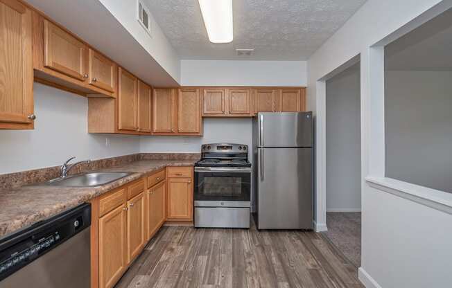 Kitchen With Custom Cabinetry at Millcroft Apartments and Townhomes, Milford, OH