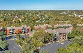 Large building with a parking lot at Great Hills, Austin, TX 78759  