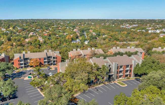 Large building with a parking lot at Great Hills, Austin, TX 78759  