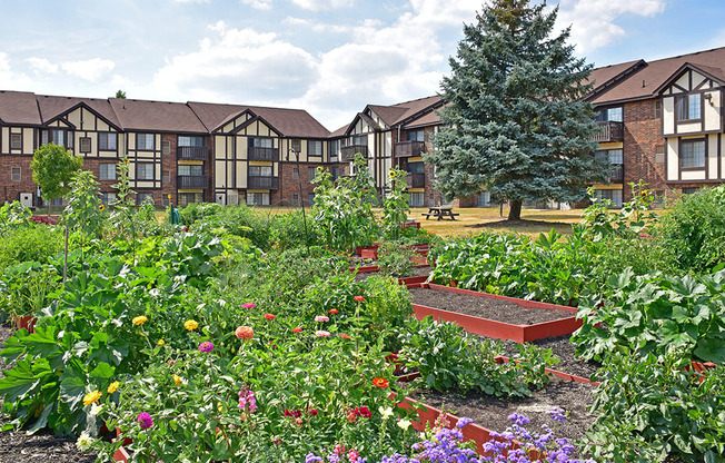 Courtyard Garden With Flowers at Charter Oaks Apartments, Davison, Michigan