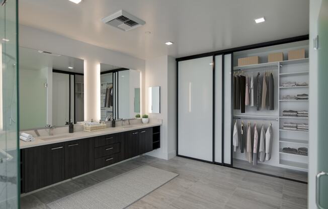 a large bathroom with a large closet and two sinks