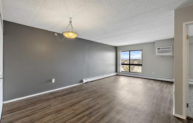 wood floors and a window at Troy Place Apartments - Troy, MI, Troy