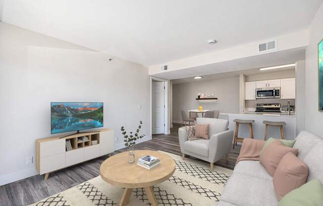 A living room with a television, couch, and coffee table.