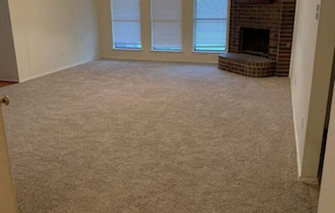 Beautifully maintained custom home on a clean and neat tree lined street