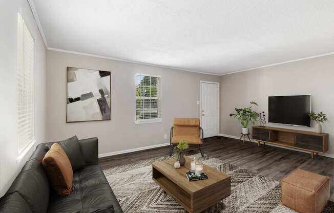 spacious living room  Living Room with wood flooring at Midtown Oaks Townhomes in Mobile, AL