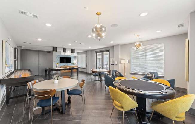 A modern dining room with a large table and chairs.