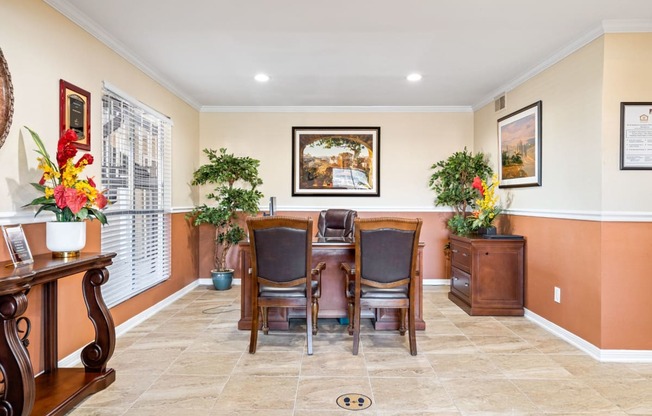 a dining room with a table and chairs