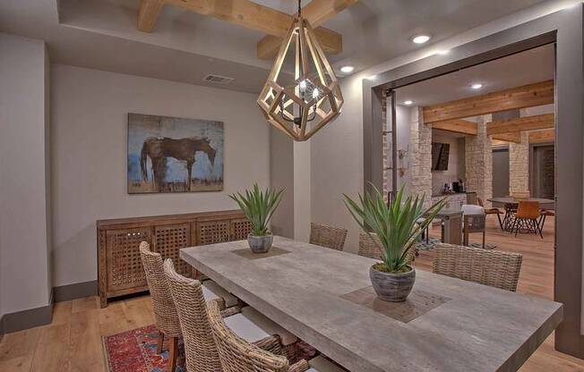 a dining room with a table and chairs at Hunters Creek Apartments, Denton, 76210