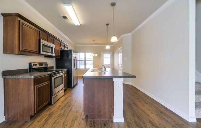 MOVE-IN SPECIAL! Spacious 4-Bedroom Townhome! This beautiful 4 bedroom, 2.5 bathroom townhome offers an open-concept layout designed for modern living.