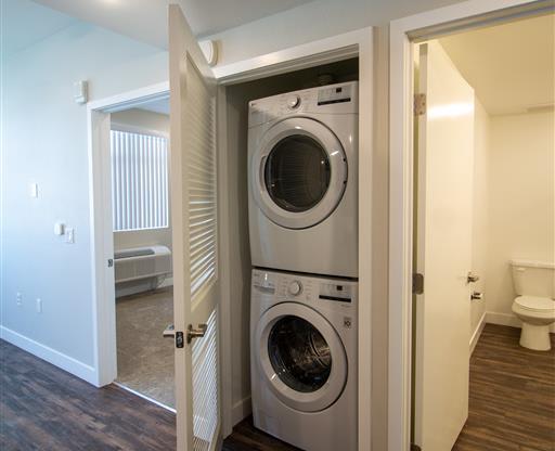 washer and dryer in a room with a toilet at Loma Villas Apartments in San Bernardino, CA