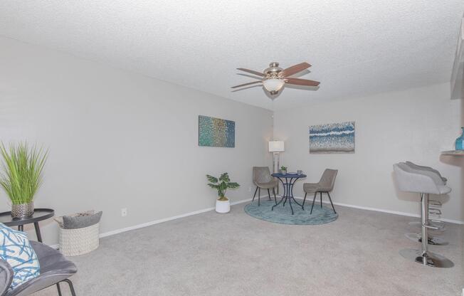 a living room filled with furniture and a lamp