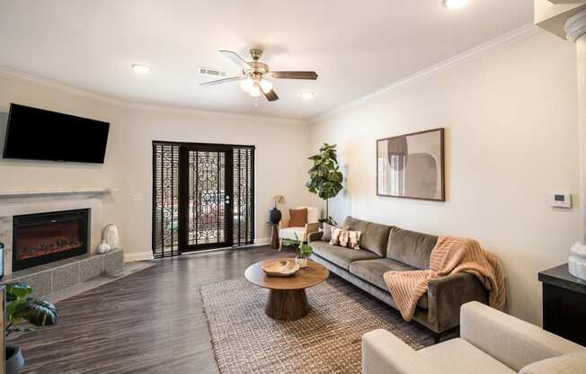 a living room with a couch and a fireplace at Arlo Luxury homes Apartments, Little Rock