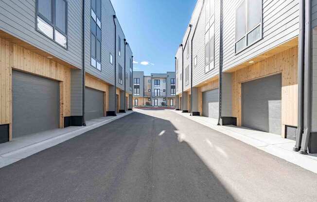 A long street with apartment buildings on both sides.