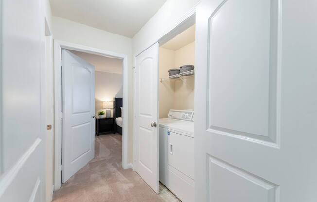 A white bathroom with a toilet and a sink.