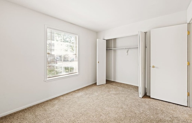 Secondary bedroom with closet in a 2-bedroom, 1-bath apartment at Briarwood Apartments, Columbus, IN.