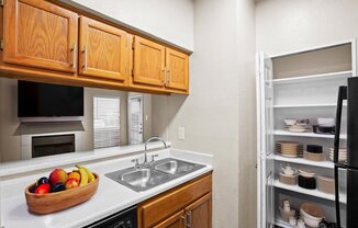 a kitchen with a sink and a refrigerator