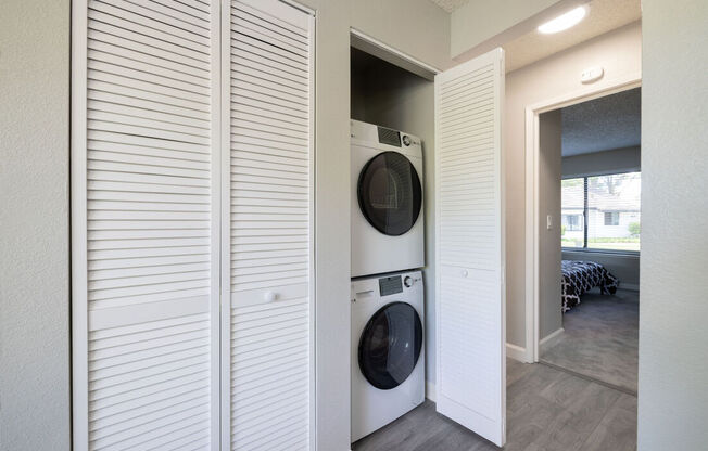 a laundry room with a washer and dryer in a closet