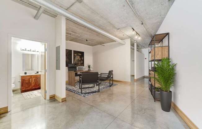 A room with a table and chairs in it.