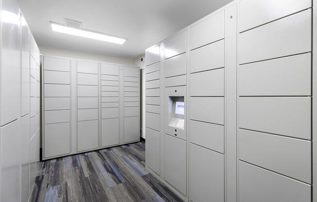 a row of white package receiving lockers at Willows Court Apartment Homes, Seattle