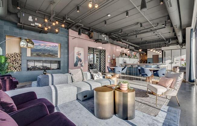 a living room with couches and chairs and a fireplace