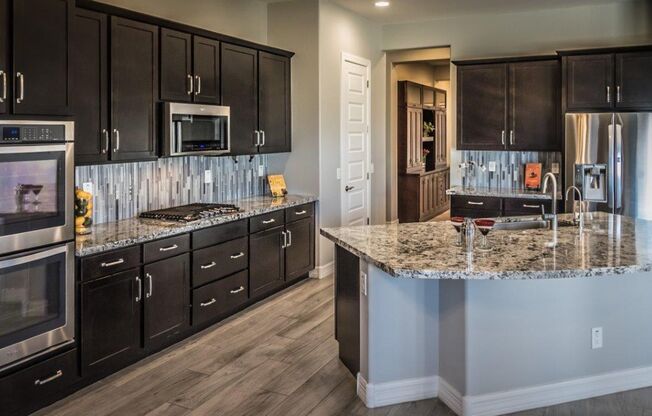 Gorgeous 4 Bed + den Single Level Home in gated community in North Peoria with RV Gate / BBQ!!