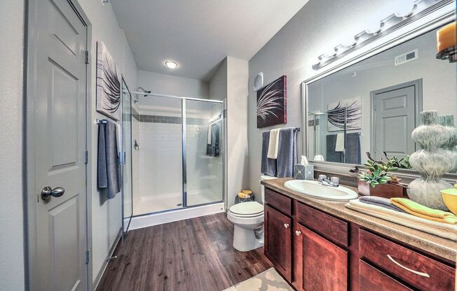 a bathroom with a shower toilet and sink at Waterstone at Cinco Ranch, Katy, 77450