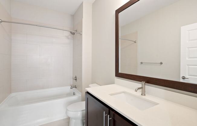 Bright bathrooms with large mirrors.