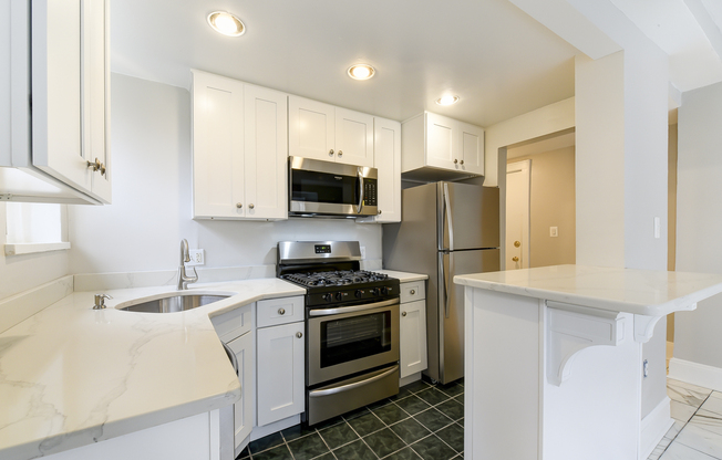 Newly Renovated Two Bedroom One Bath Condo For Rent With Elegant Marble Flooring, Stainless Steel Appliances, Custom Kitchen, & Sleek Hardwoods!